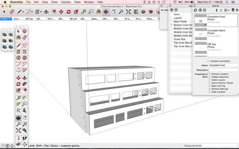 a computer screen shows a drawing of a building in sketchup pro