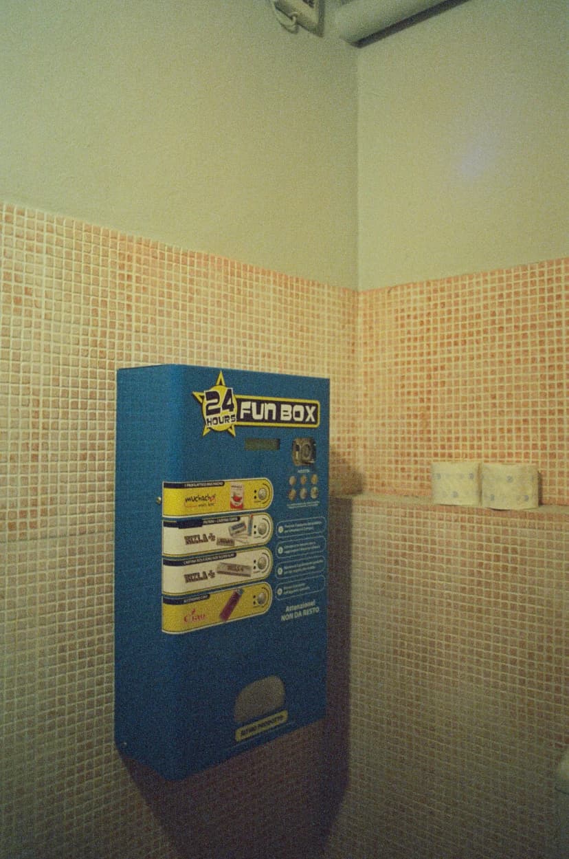 a 24 hour fun box vending machine in a bathroom