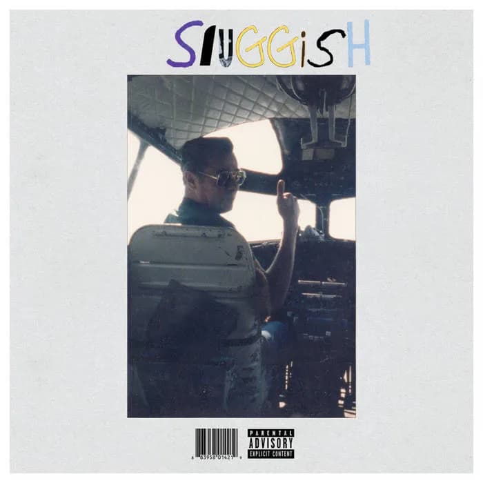 a man is sitting in the cockpit of an airplane on the cover of a parental advisory album .